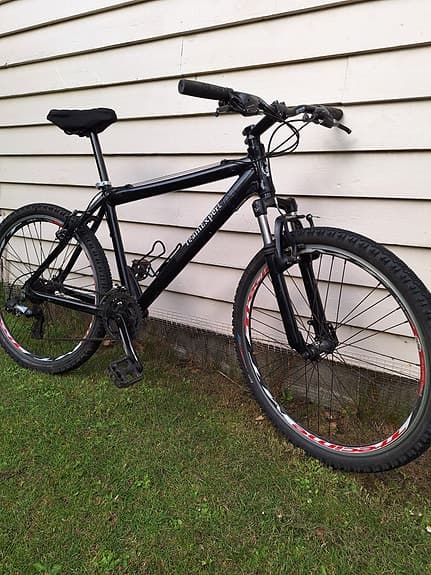 Velholdt herre mountainbike med 21 gear, støddæmpere, 2 håndbreder