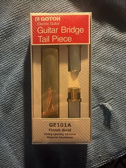 GE101A electric guitar bridge tailpiece kultainen