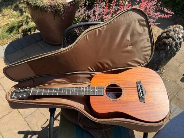 Barely used baby Taylor Acoustic Guitar, left handed set up