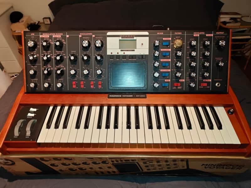 Moog Minimoog Voyager Select Series 44-Key Monophonic Synthesizer - Solar Cherry, with rare gold cutoff knob, and dust cover.